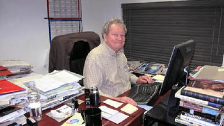 A Race Well Run John Ross Schroeder working at his desk.