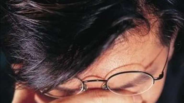 A Time to Weep A man holding his head in sadness.