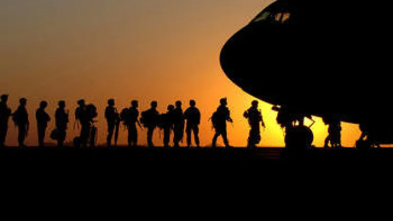 Soldiers boarding an airplane.