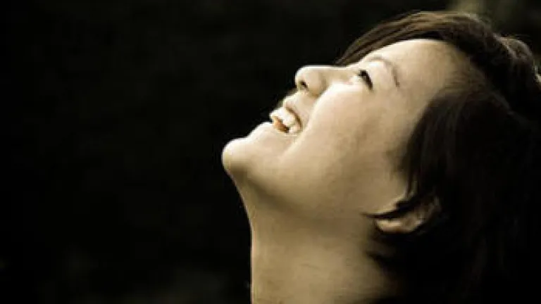 A woman looking up into the sky.