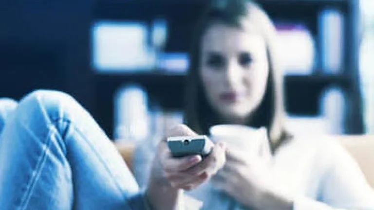 BUSY - a woman holding a TV remote