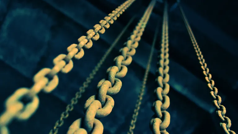 Pray that God will bless you with success in breaking free from any bondage—and that you will remain free and filled with the joy that comes from living a good and godly life. Old chains hanging down from a dark ceiling.