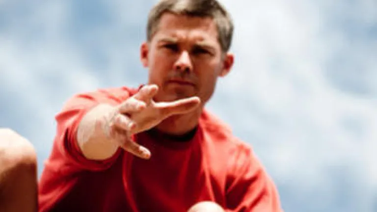 Do you exercise power? Or do you lead? A man reaching out his hand to help pull someone up.