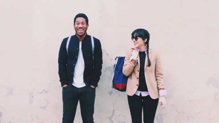 People often come to the truth because they are impacted in a powerful way by those who already have it. Are you a noticeably pleasant person? Do you go out of your way to be friendly? It matters! Two young adults waiting for a bus - both with smiles on the faces.