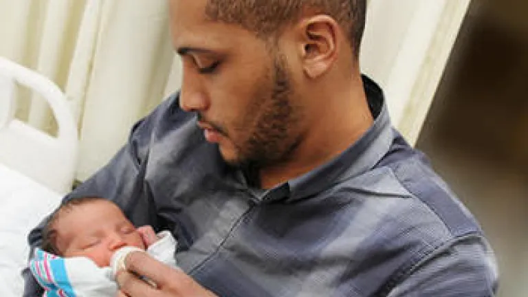 God, Science and the Bible: The Miracle of Birth: "I Saw God Today" A new dad holding his baby.