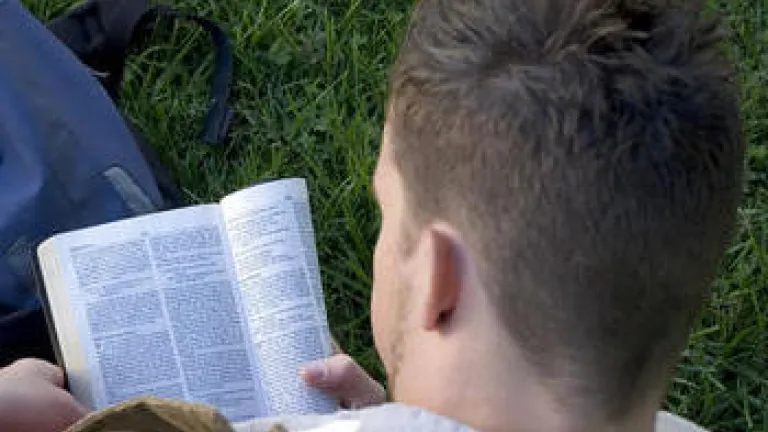 How Are We to Prepare for Momentous End-Time Events? A young man reading the Bible.