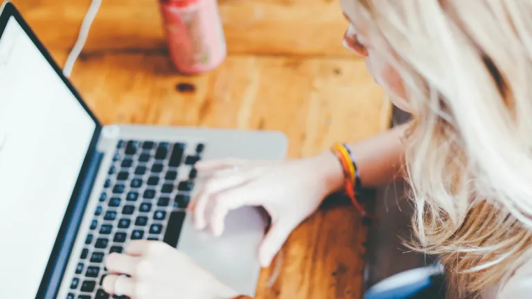 Click on the word you want to define and you will be given the Strong’s definition as well as access to a word study definition. A woman typing on a Mac laptop.
