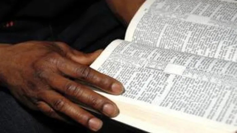 Black hand and Bible - Jesus Christ and the Sabbath