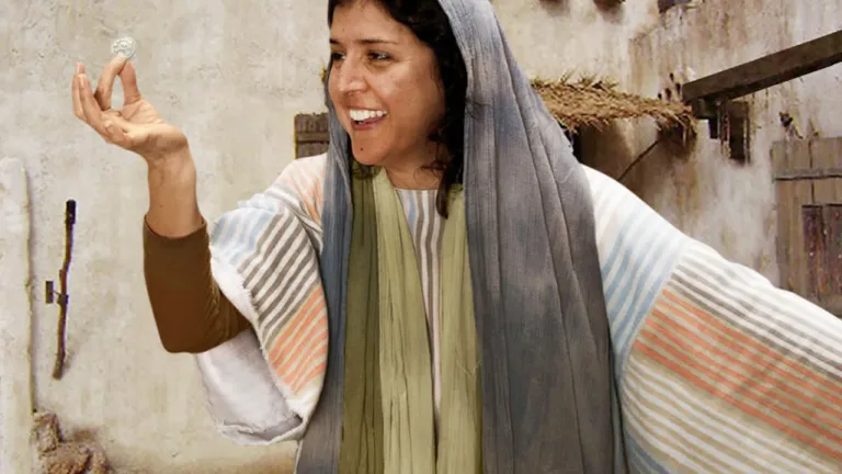 The woman in Jesus’ parable was overjoyed when she found her lost coin. His parable teaches us about God’s desire for a right relationship with us. A reenactment of a woman holding a lost coin.