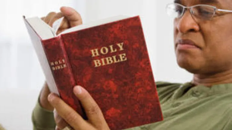 A man reading a Bible.