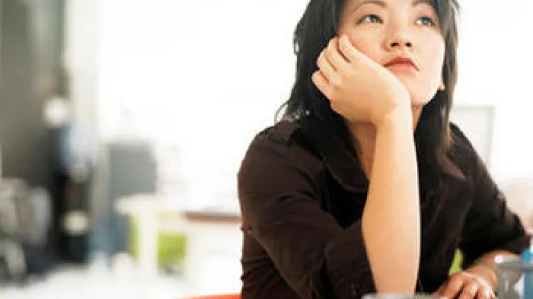 Listen to Your Still Small Voice A woman with her head resting on her hand and looking thoughtfully.