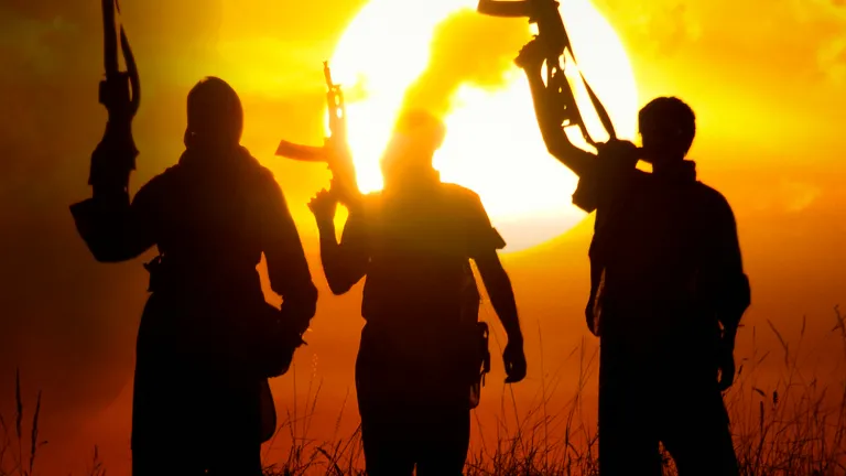 We cannot understand so much of what’s happening in the world if we don’t understand what’s taking place in the Middle East and why. Three men holding machine guns in the air.