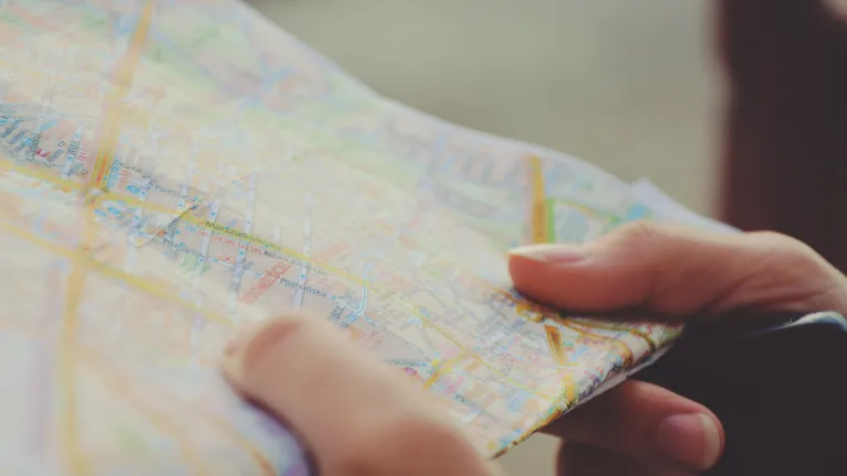 Hands holding a map.