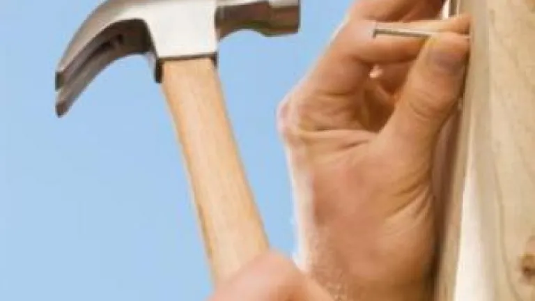 Nails In A Board Hammering nails into a board
