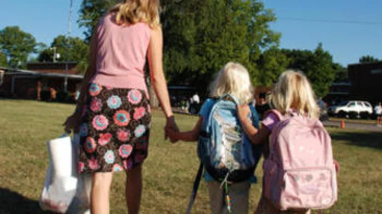 mom and daughters going to school