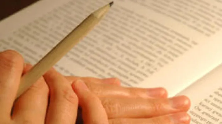 hands holding book open