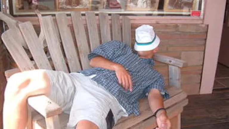 man sleeping on a bench
