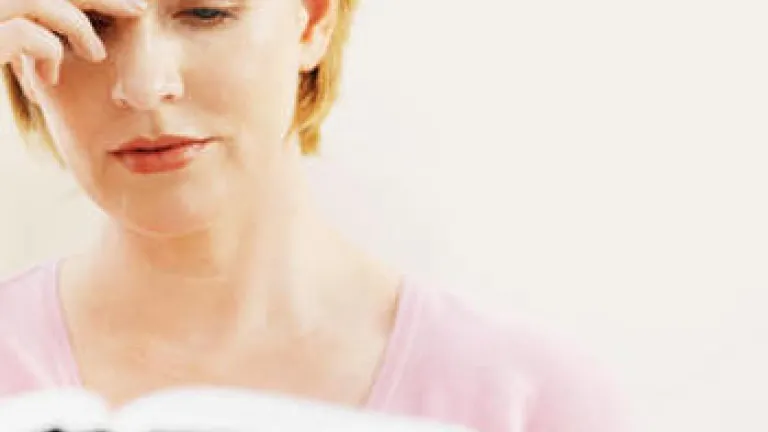 Questions and Answers: Is tithing really a part of New Testament teaching? A woman reading the Bible