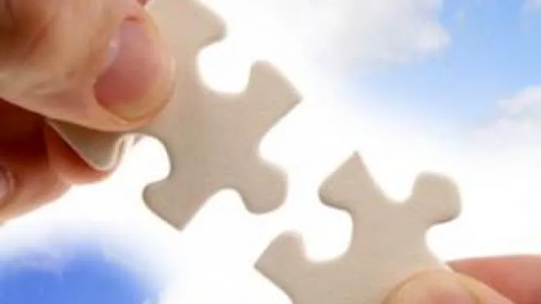 The Bible and Archaeology: Two Jigsaw Puzzles, Two Purposes Hands Holding Jigsaw Puzzle Pieces In Front Of Blue Sky