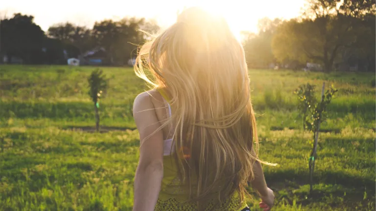 Joy is largely composed of gratitude— gratitude for the wonderful things God has done for us and His “exceedingly great and precious promises” for our future. A young woman running in a field.