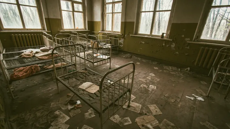 Metal frames of children's beds are all that are left in this abandoned room from the 1986 Chernobyl disaster. Metal frames of children's beds are all that are left in this abandoned room from the 1986 Chernobyl disaster.