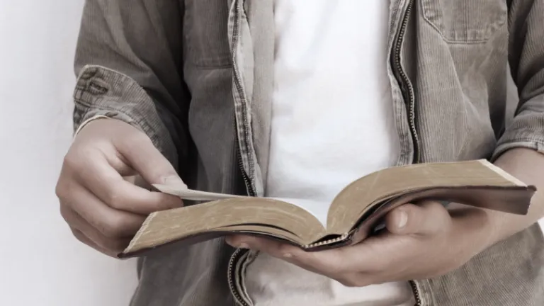 A man reading a Bible.