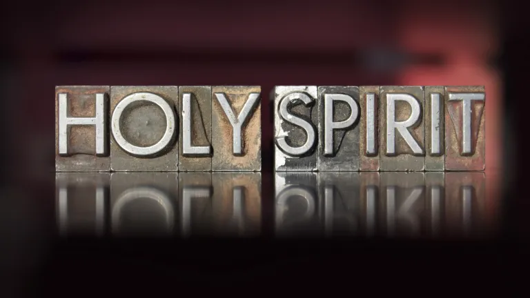 Wood letterpress blocks that spell the word "Holy Spirit".