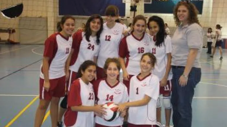 stella helterbrand with the volleyball team she coached in Jordan