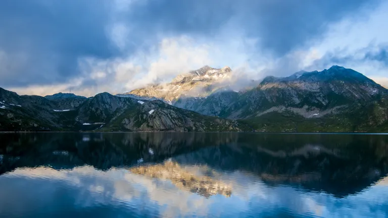 A photo of a beautiful scenery of mountains and a lake.