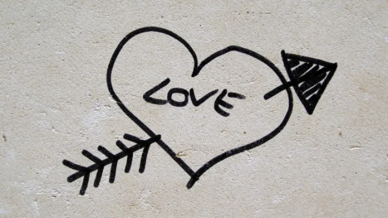 Why is it important to know the origin of Valentine's Day? Graffiti heart with arrow and love