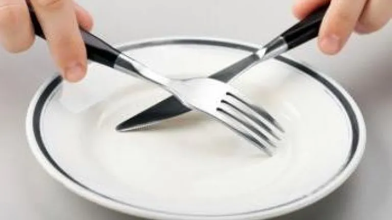 What Does the Bible Teach About Fasting? Fork and knife crossing over empty plate - What Does the Bible Teach About Fasti