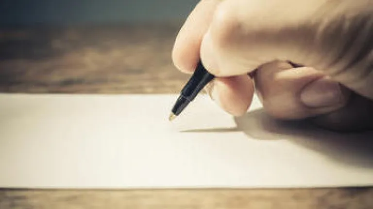 When "Goodbye" Comes Too Suddenly Writing on a paper.