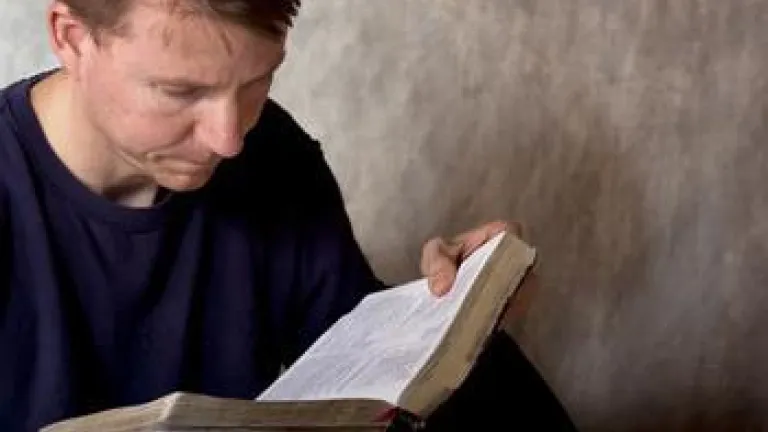 Why Do We Care About the Bible? A man reading a Bible.