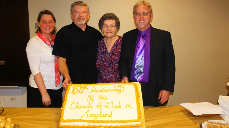 Members of the Maryland church show off the 50th Anniversary cake.