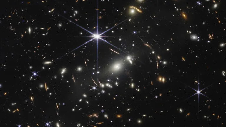 An infrared image of galaxy cluster SMACS 0723, the first operational image from NASA’s James Webb Space Telescope. Stars seen through a telescope