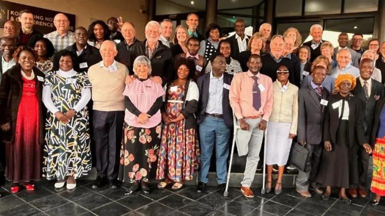 a large group of people standing indoors