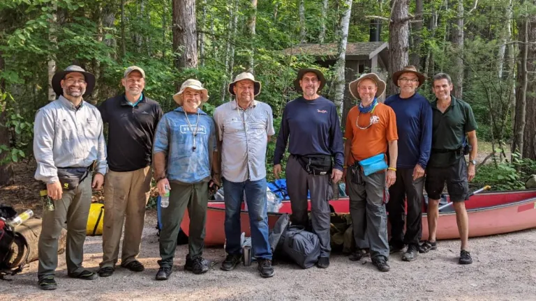 Chris Rowland, Paul Moody, Mark Welch, Michael Fike, Doug Wendt, Jeff Lockhart, Skeets Mez and Frank Dunkle after completing their adventure in the Boundary Waters Canoe Area Wilderness of Minnesota.