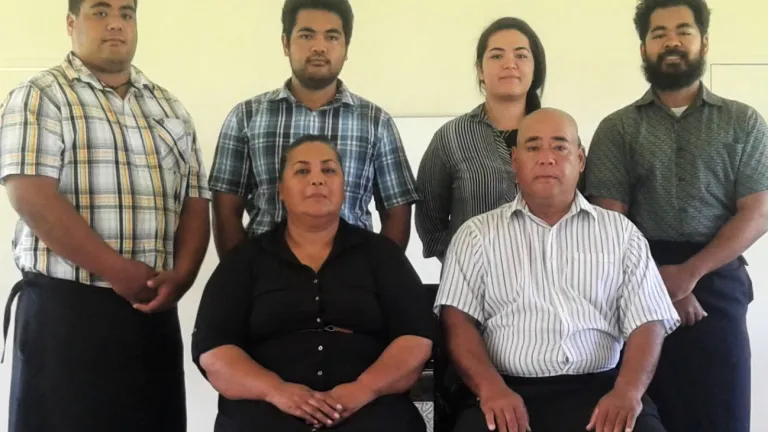 Frank Osika and his family at the Sabbath service hall on their property in Tonga.