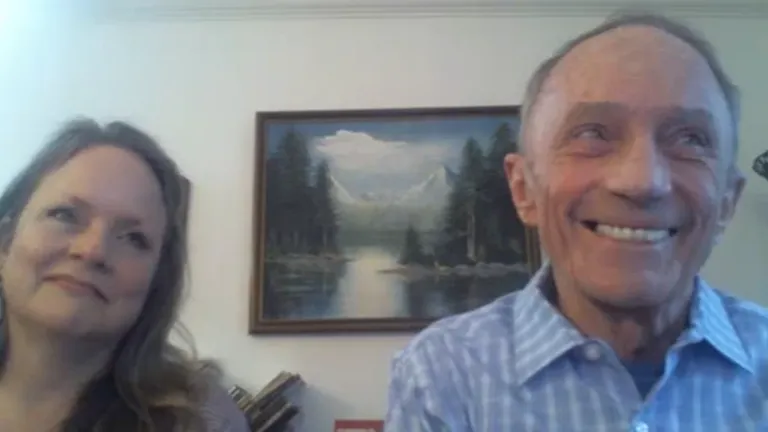 Don Hooser and his daughter, Amy, listen to employees acknowledging his many years of service to the Church.