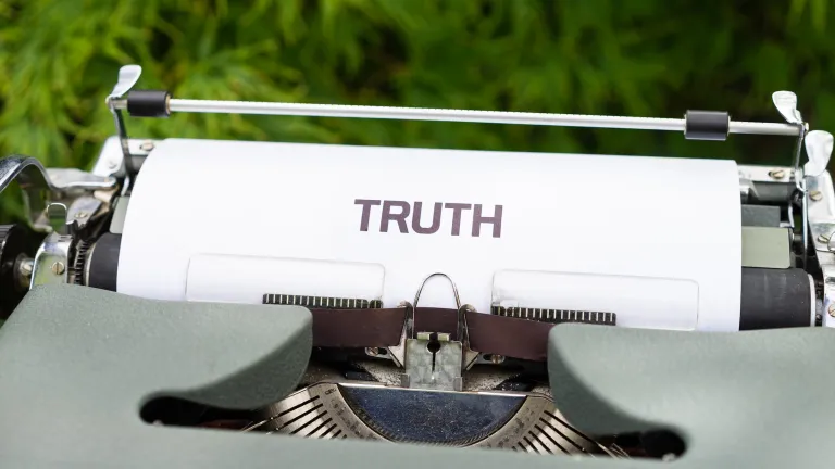 Image of a typewriter with TRUTH on the page.