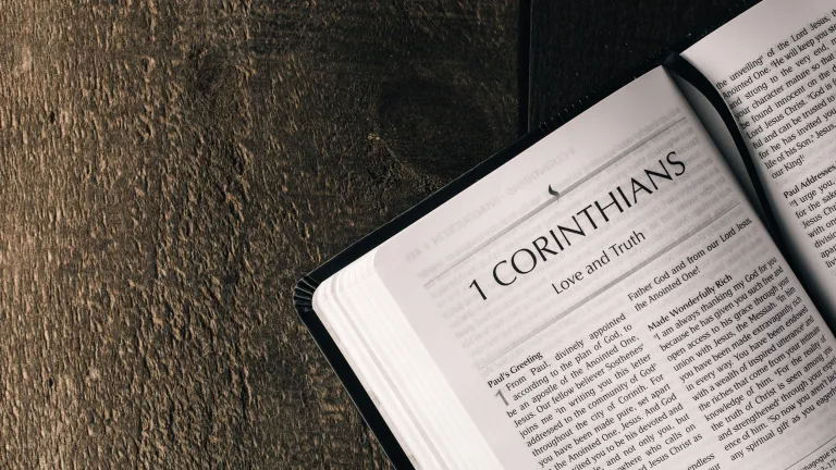a Bible open to the book of 1 Corinthians