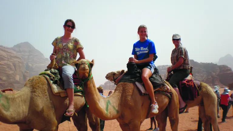 Wadi Rum in Jordan at the Feast of Tabernacles 2010. In this photo Stella is (at the right wearing a hat) riding a camel with friends Alyssa Diggins and Mary Miller.