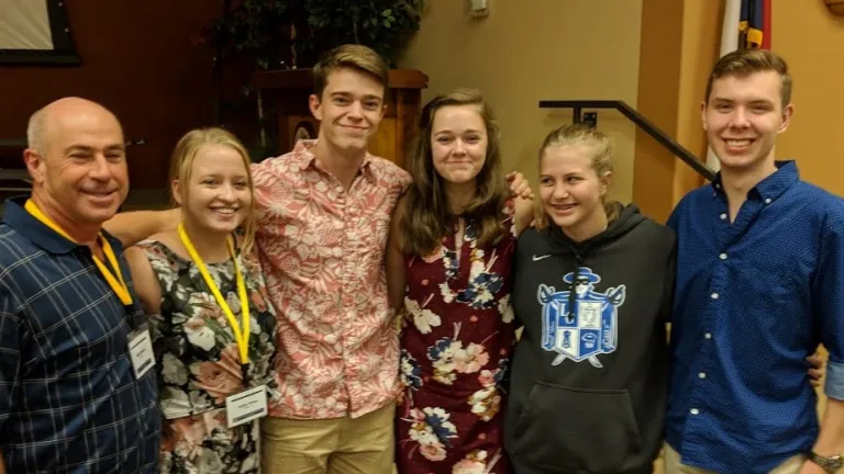 Regional Pastor Mark Welch with some of the younger attendees of the Leadership Workshop.