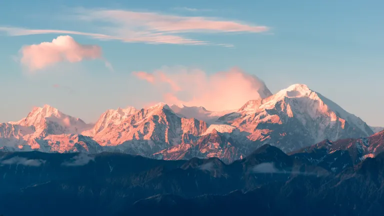 Aerial photo of purple mountain range in daylight.