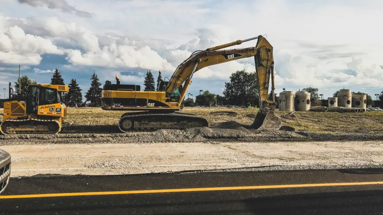 construction equipment working on a site and removing dirt