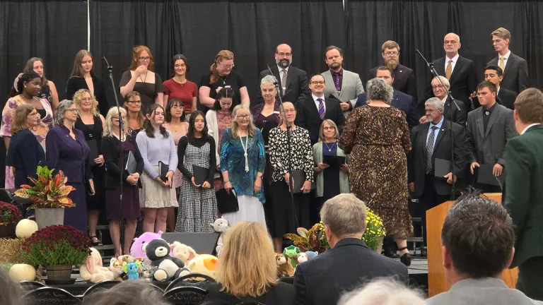 a choir performing on a stage