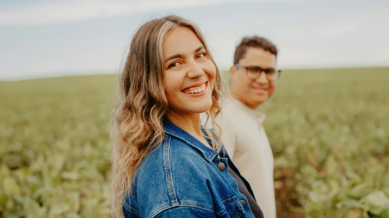 a woman and a man in a field