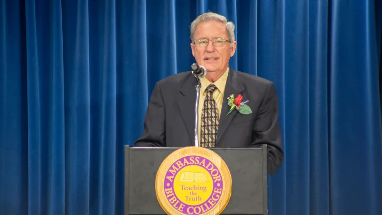 a man standing at a lectern