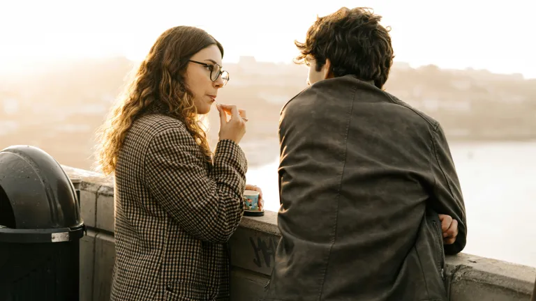 A man and woman talking. 