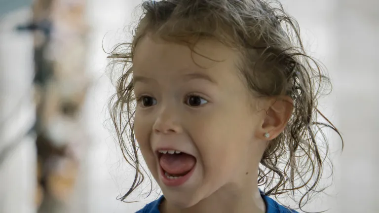 A young child singing.
